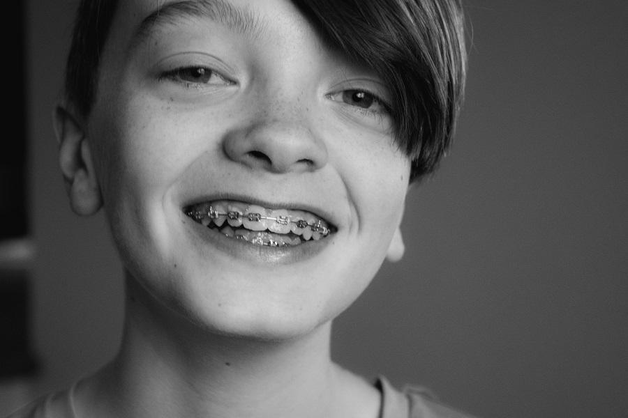 A boy wearing braces